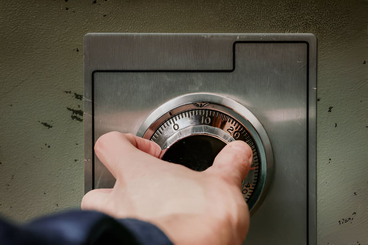 Person using security safe with mechanical combination lock or dial safe lock