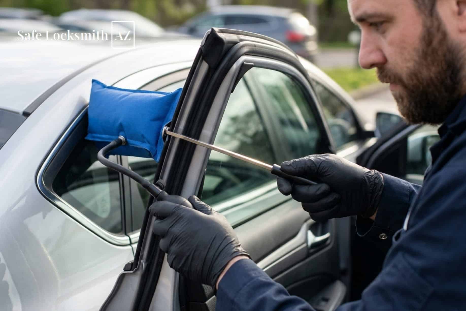 Locksmith unlocking a vehicle using an air wedge.